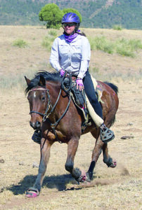 Kathy Oliver riding Timber at Man Against Horse